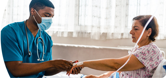 A nurse administers IV treatment to an acute lymphoblastic leukemia patient.